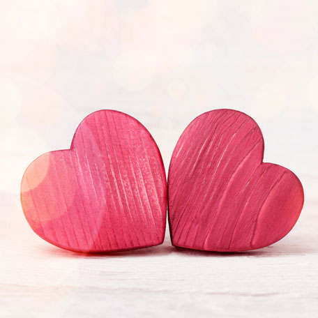 Two red wooden hearts