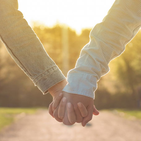 a young couple holding hands